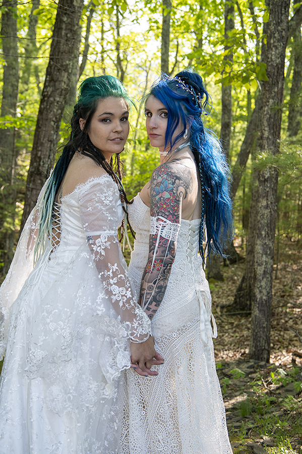 brides in the forest on their wedding day at Riedlbauer’s Resort in the Catskills. LGBTQ wedding