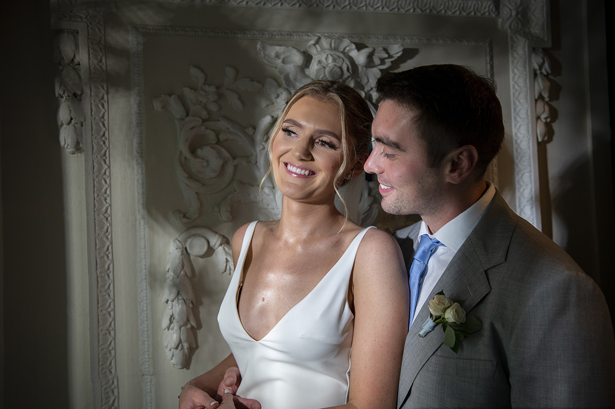 bride and groom pose for portraits on their wedding day at Orienta Beach Club