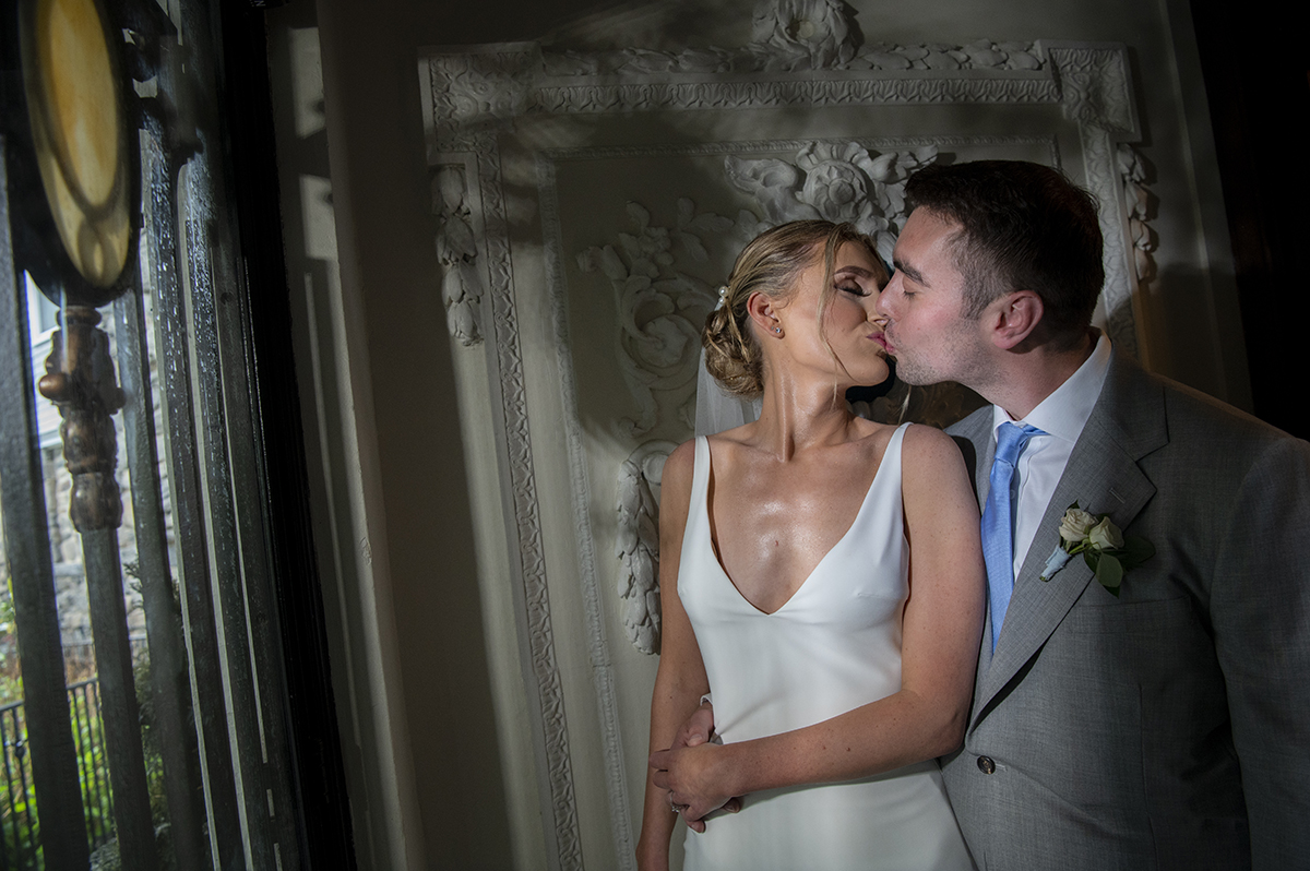 bride and groom pose for portraits on their wedding day at Orienta Beach Club