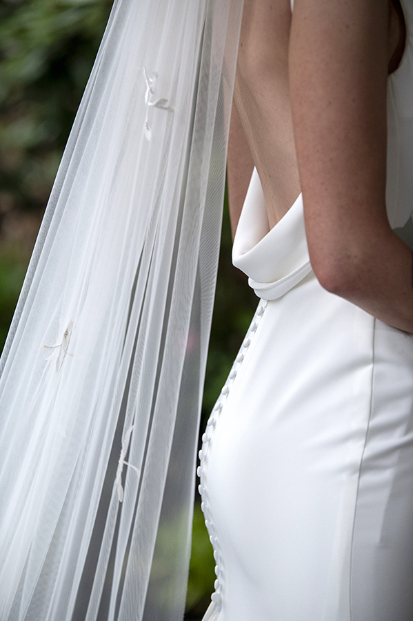 bride pose for portraits on their wedding day at Orienta Beach Club