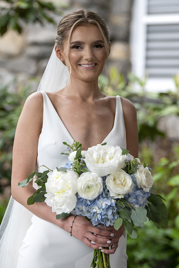 bride pose for portraits on their wedding day at Orienta Beach Club