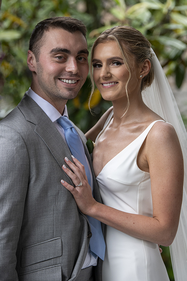 bride and groom pose for portraits on their wedding day at Orienta Beach Club