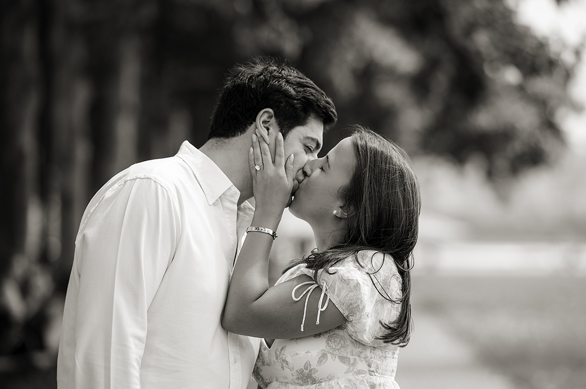 newly engaged couple at Pier A in Hoboken kissing