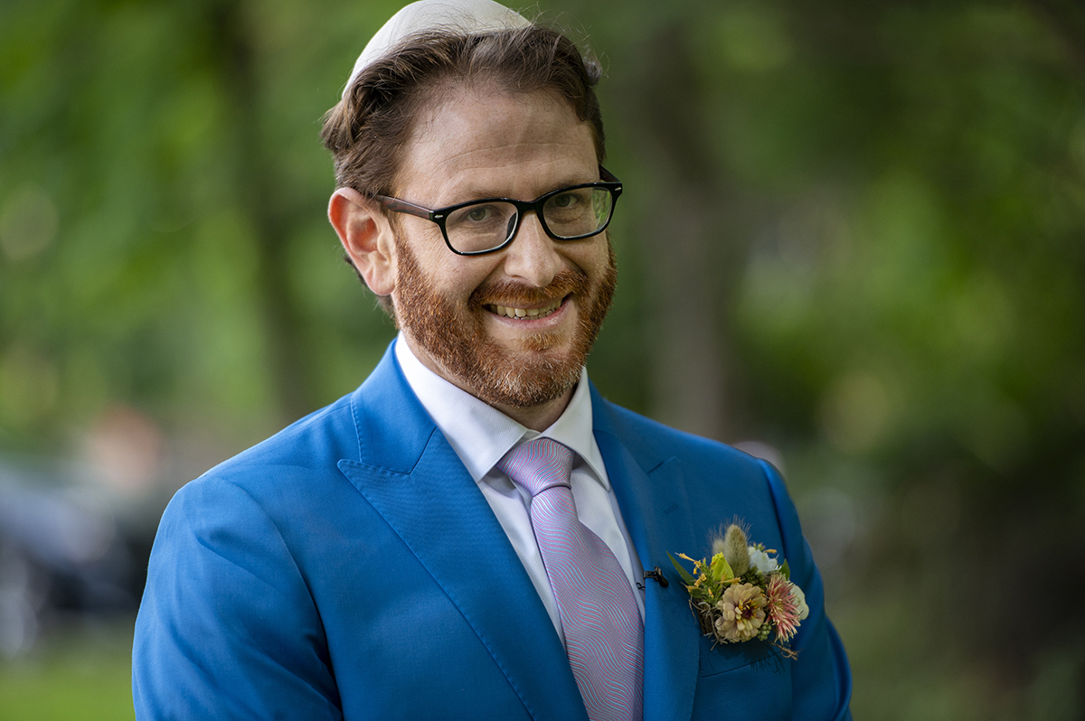 groom at Temple Emanu-El of Closter on their wedding day