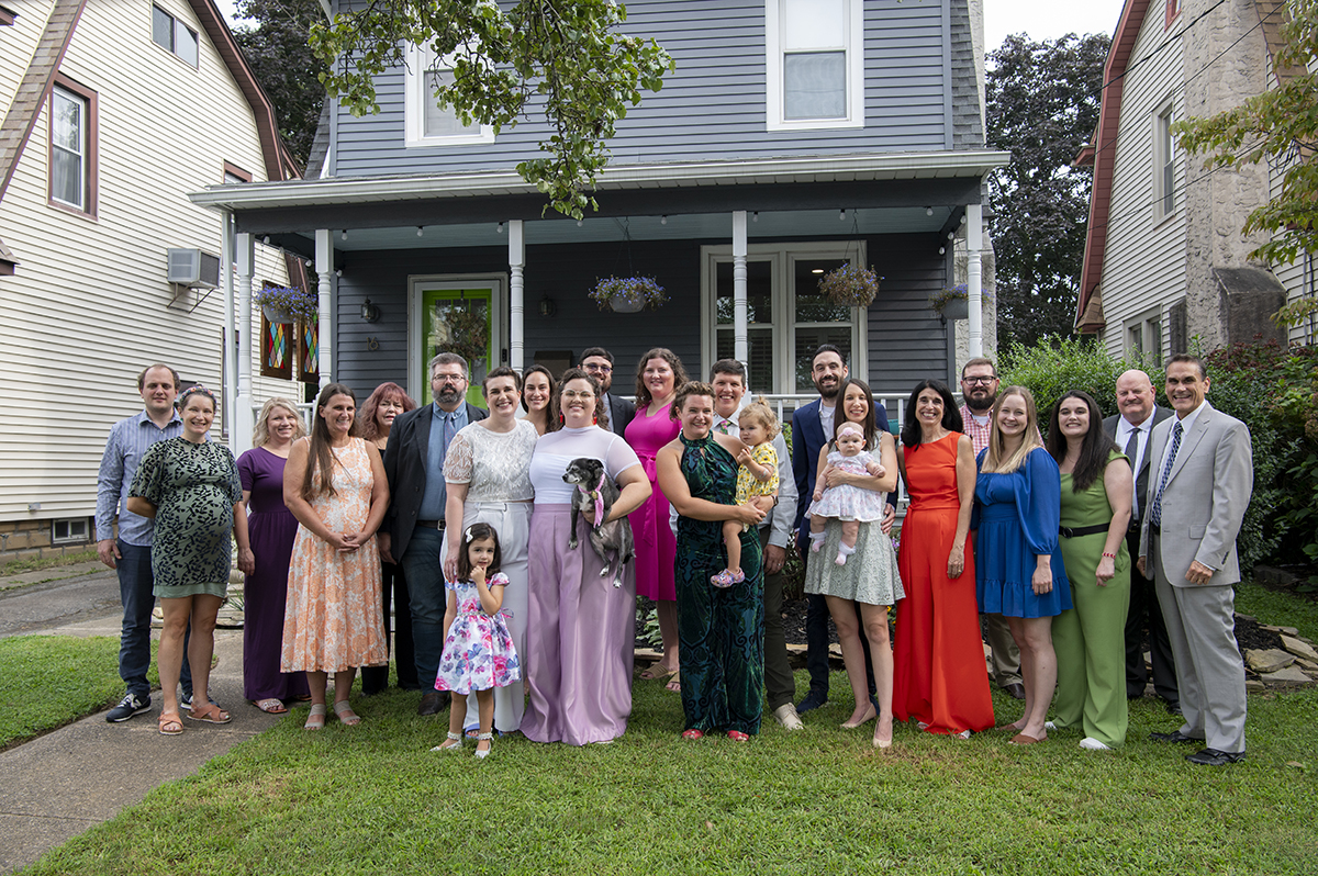 wedding guests pose for a photo before New Jersey backyard wedding