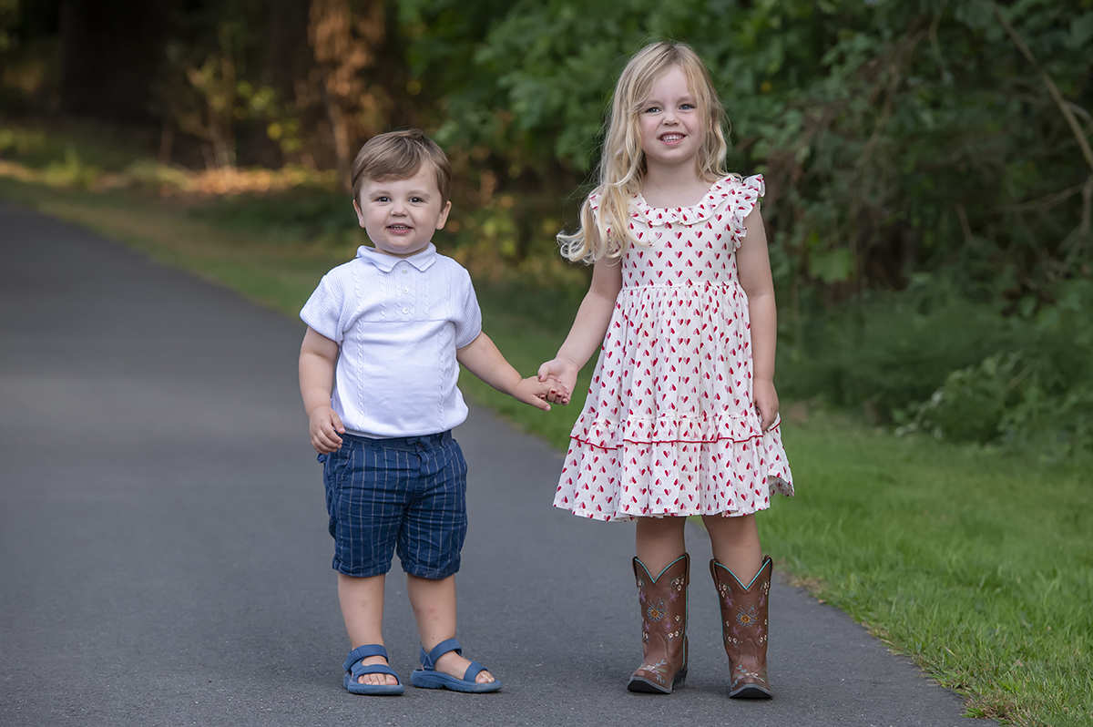 brother and sister posing for fall family photos in Arlington, VA