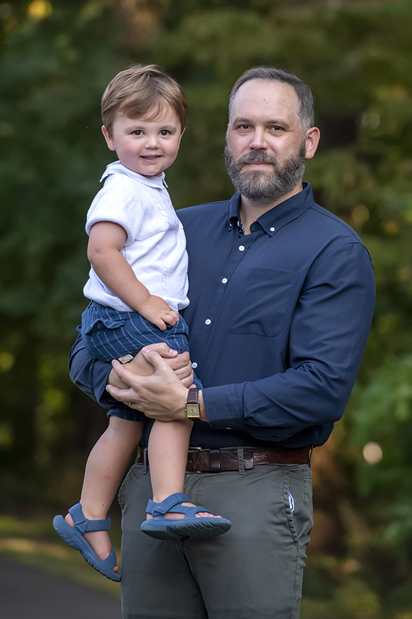 dad and son posing for fall family photos in Arlington, VA