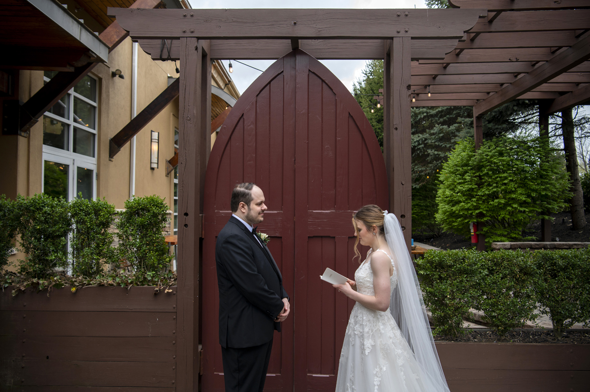 bride and groom first look at Stone House at Stirling Ridge wedding