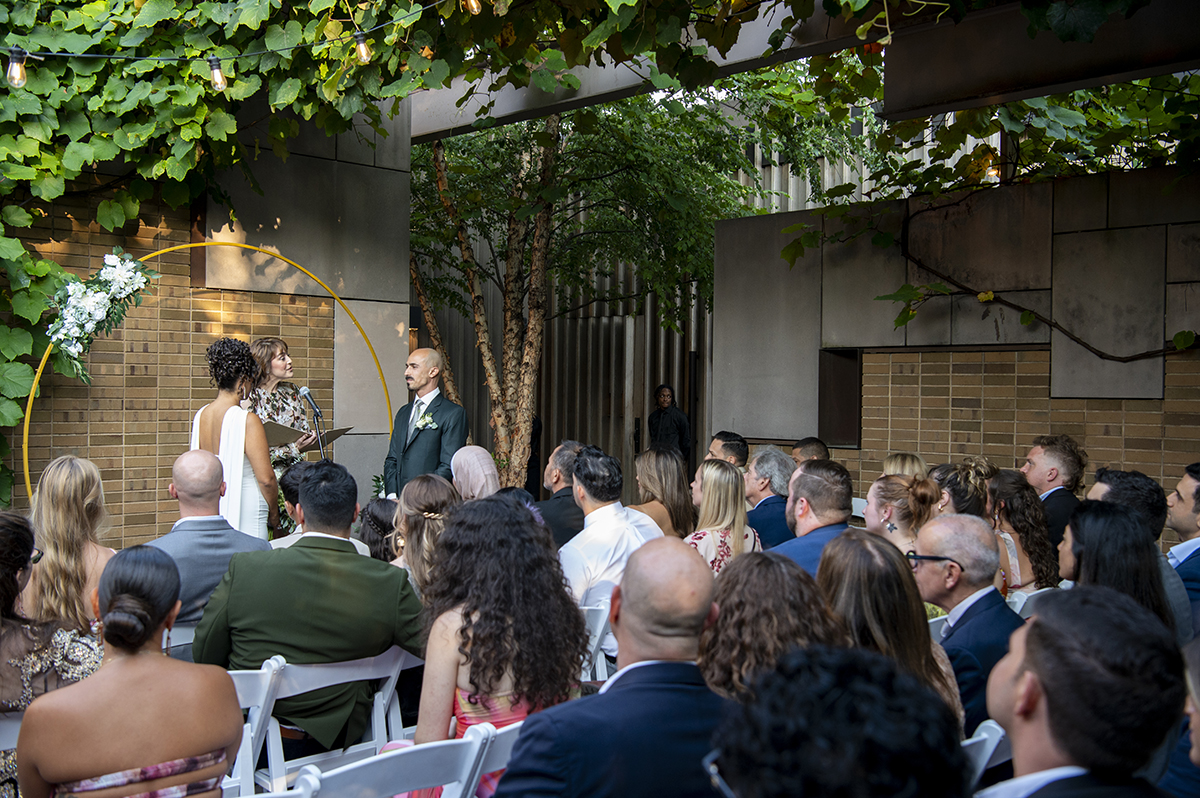 newlywed couple during wedding ceremony at Carroll Hall in Brooklyn