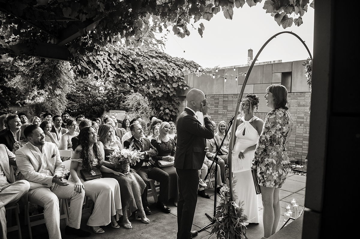 newlywed couple during wedding ceremony at Carroll Hall in Brooklyn