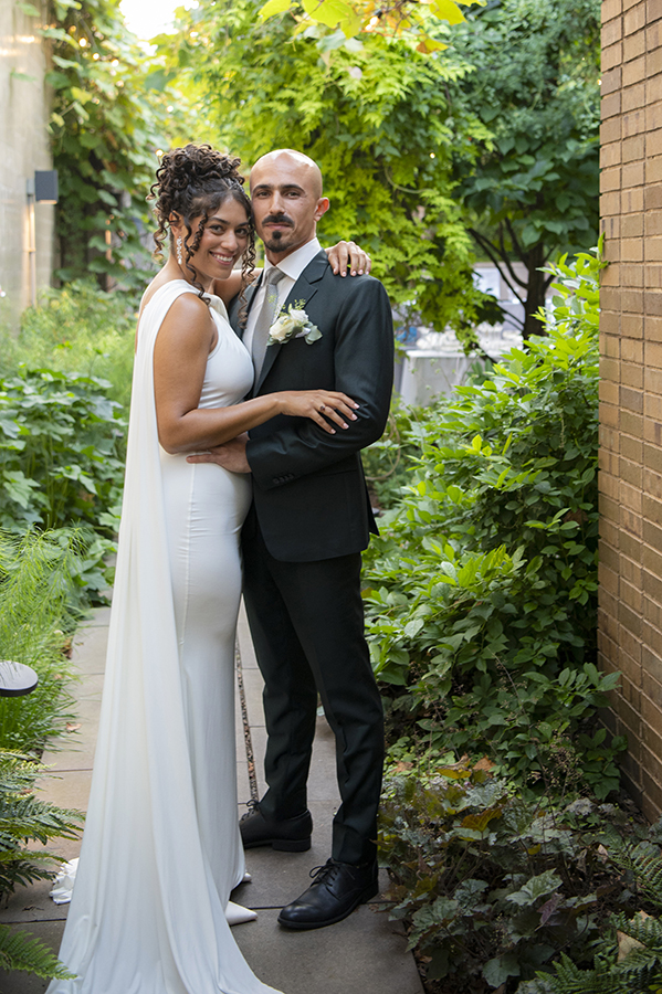 newly wed couple posing for portrait during wedding at Carroll Hall in Brooklyn