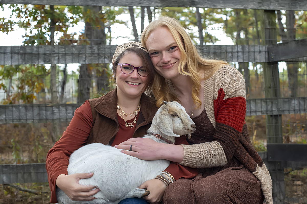 same sex engaged couple at farm for fall engagement photos