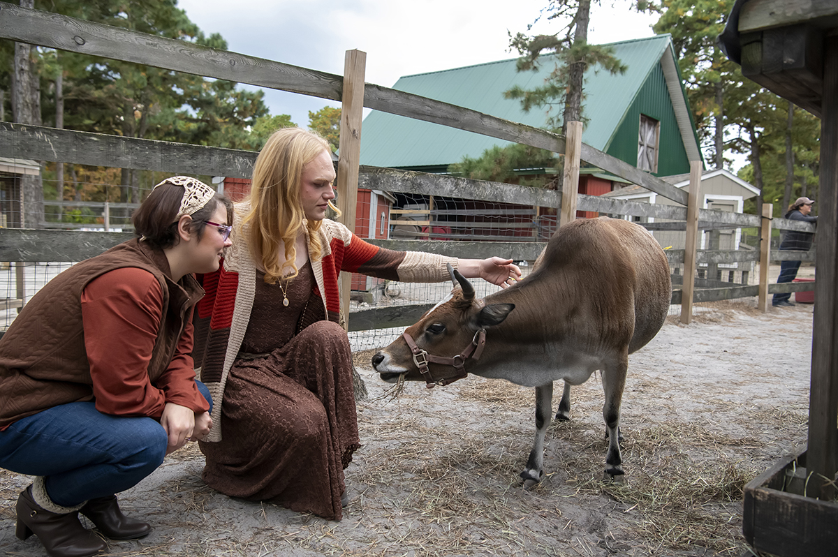 same sex engaged couple at farm for fall engagement photos
