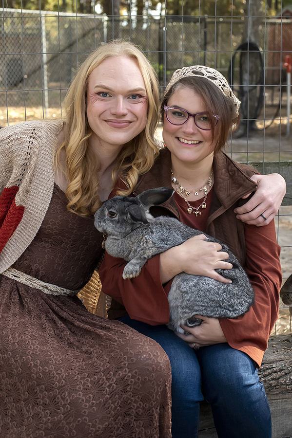 same sex engaged couple at farm for fall engagement photos