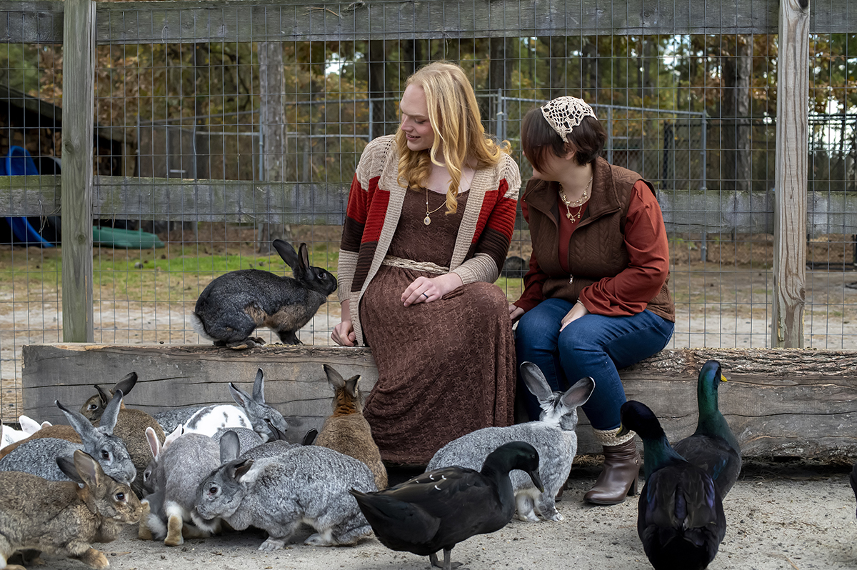 same sex engaged couple at farm for fall engagement photos