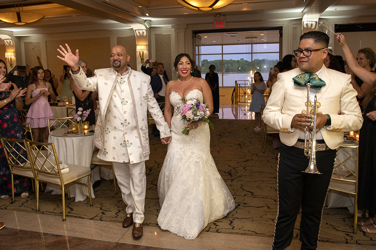 bride and groom enter their wedding reception at Glen Island Harbour Club